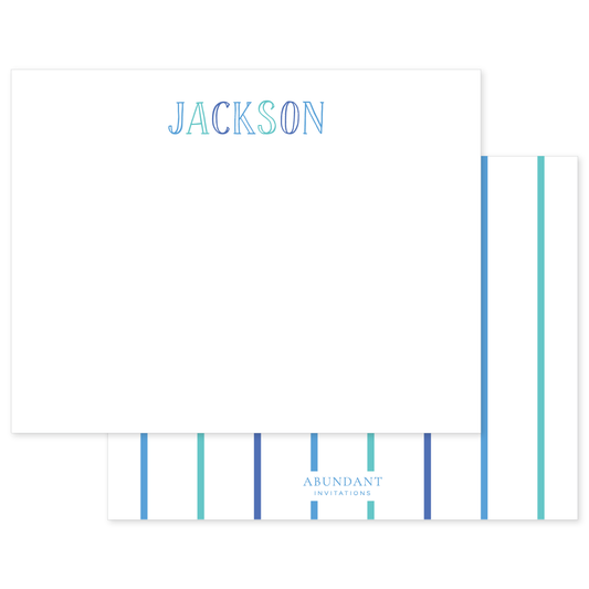 Personalized white notecard featuring blue and teal chalkboard-style letters spelling a name, with a striped back design in coordinating colors.