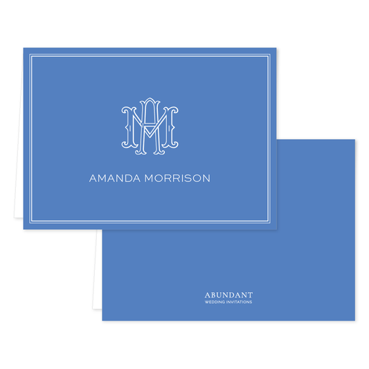 Folded notecard in classic cobalt blue featuring a white monogram and personalized name with clean, timeless design and subtle border accents.