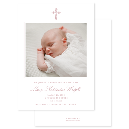 Newborn baby photo with birth announcement card design and baby pink hand drawn cross on a white background