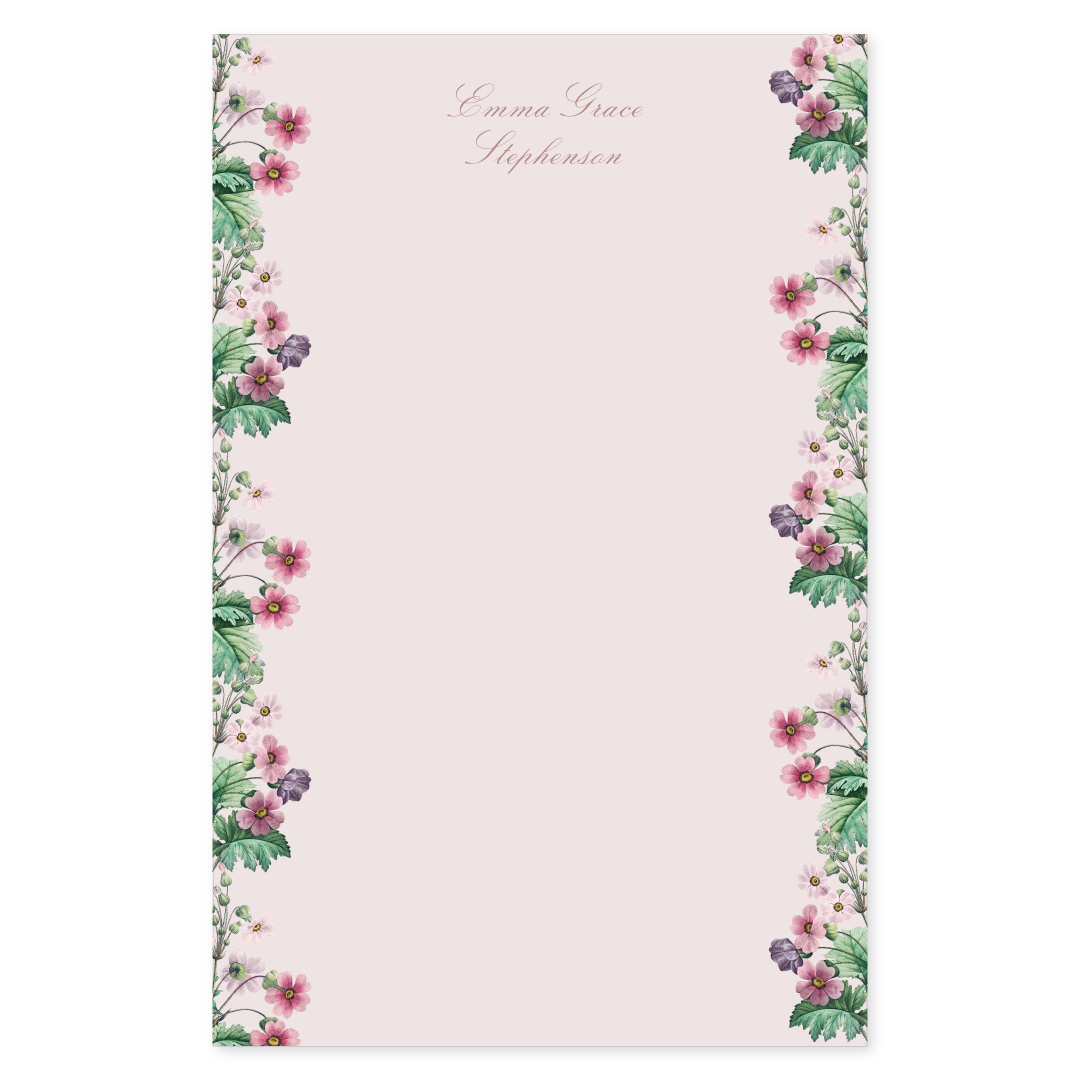 Notepad with a primrose floral border design on a light pink background with a script name at the top.