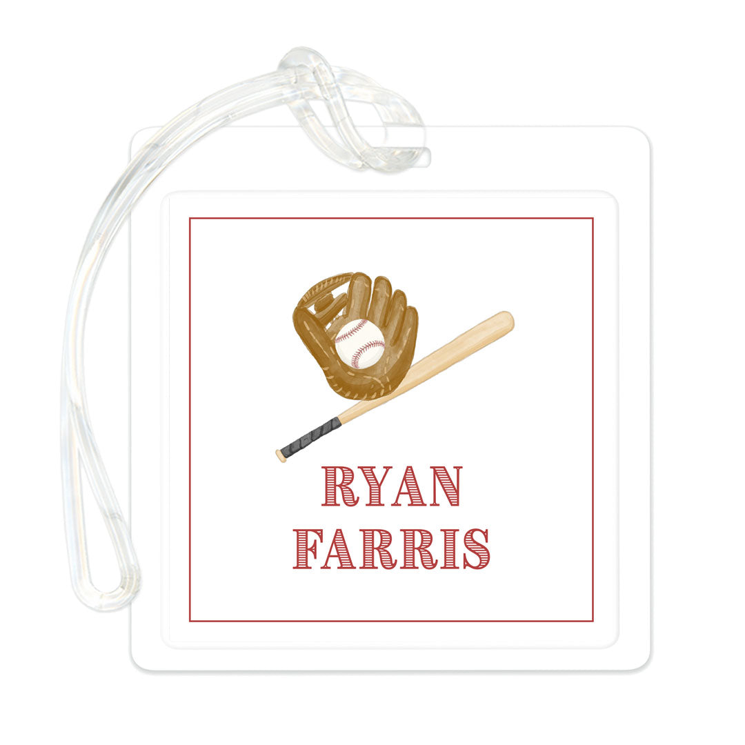Clear rectangular bag tag featuring a baseball glove, bat, and personalized name in red text with a simple red border.
