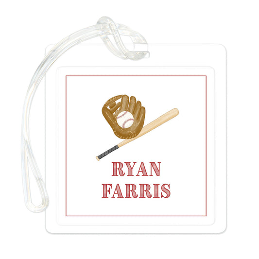 Clear rectangular bag tag featuring a baseball glove, bat, and personalized name in red text with a simple red border.