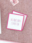 Square pink-bordered calling cards with elegant pink outlined letters on white, personalized for event or wedding stationery.