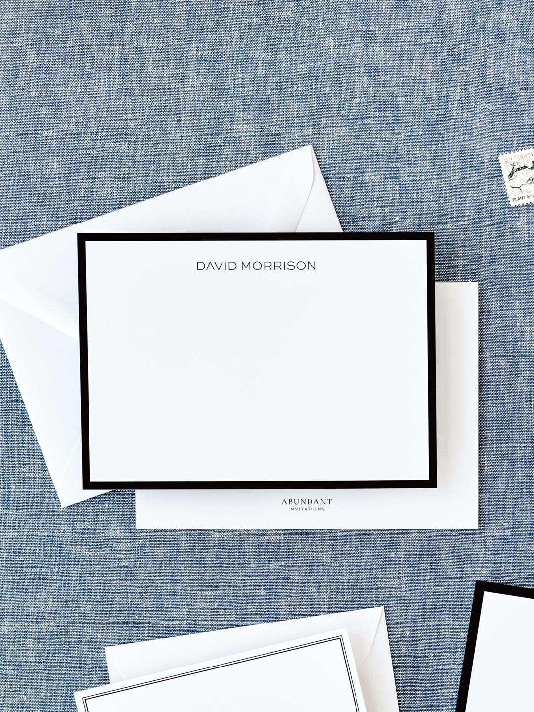 Elegant personalized flat notecard with a classic black border and clean, minimalist design, styled for timeless stationery use.