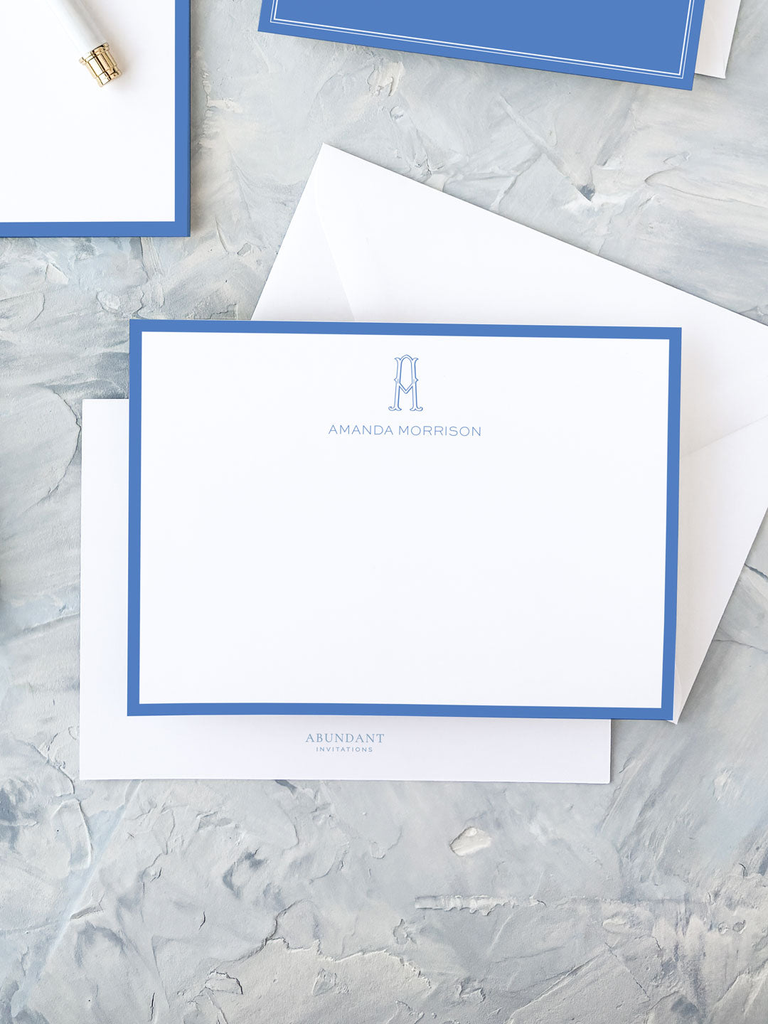 Elegant personalized flat notecard with a cobalt blue border and a custom monogram, perfect for timeless, classic correspondence.