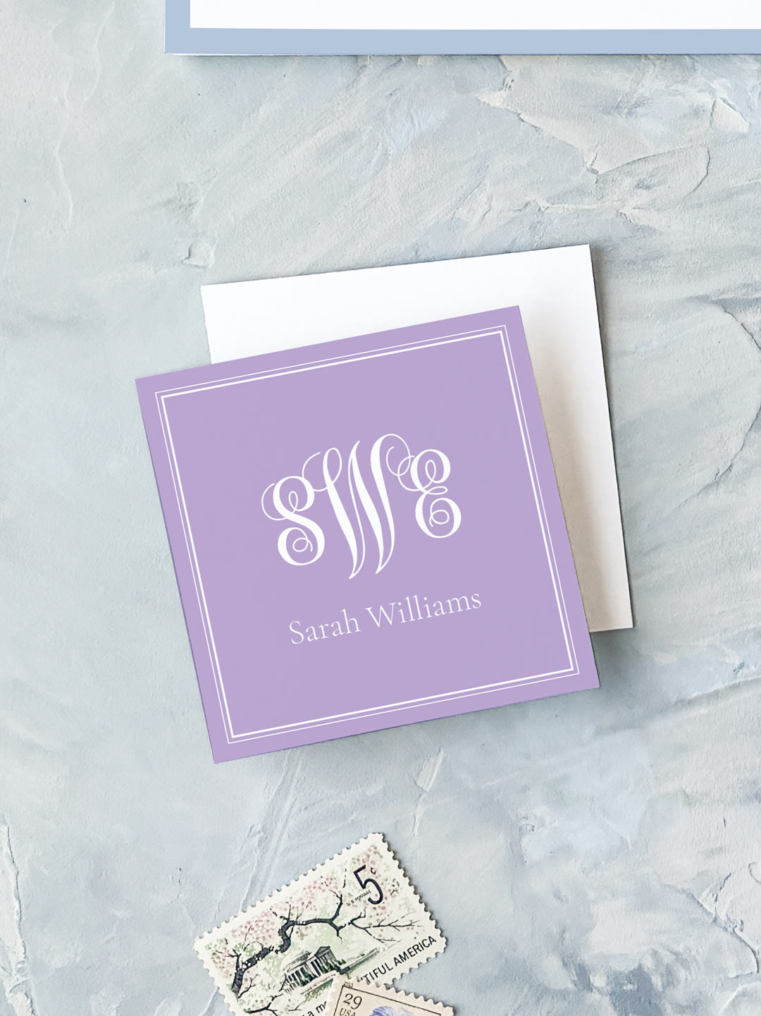 Square lavender calling card with elegant white monogram and personalized name on textured background
