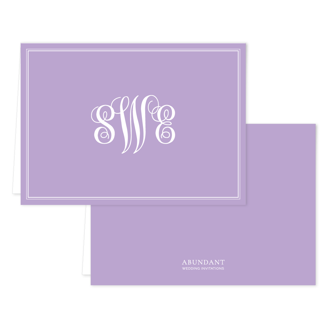 Folded lavender notecard with elegant white monogram initials in the center, bordered by a double-line frame, personalized stationery for special occasions.