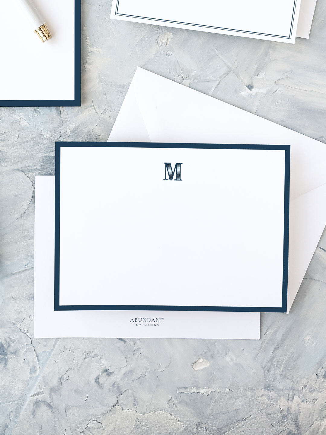 Elegant flat notecard featuring a classic navy border and a centered monogram, perfect for personalized stationery and timeless correspondence.