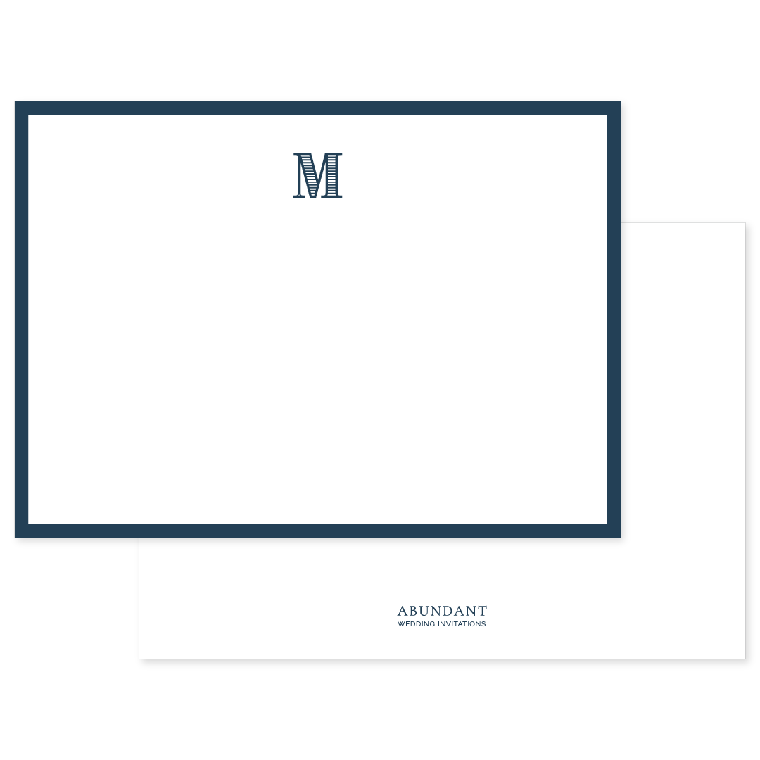 Flat white notecard with a classic navy blue border and a bold navy monogram letter M at the top center, personalized stationery design.