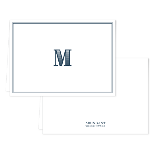 Folded notecard in classic navy featuring a striped initial "M" on the front with a double-line border and a clean white background.