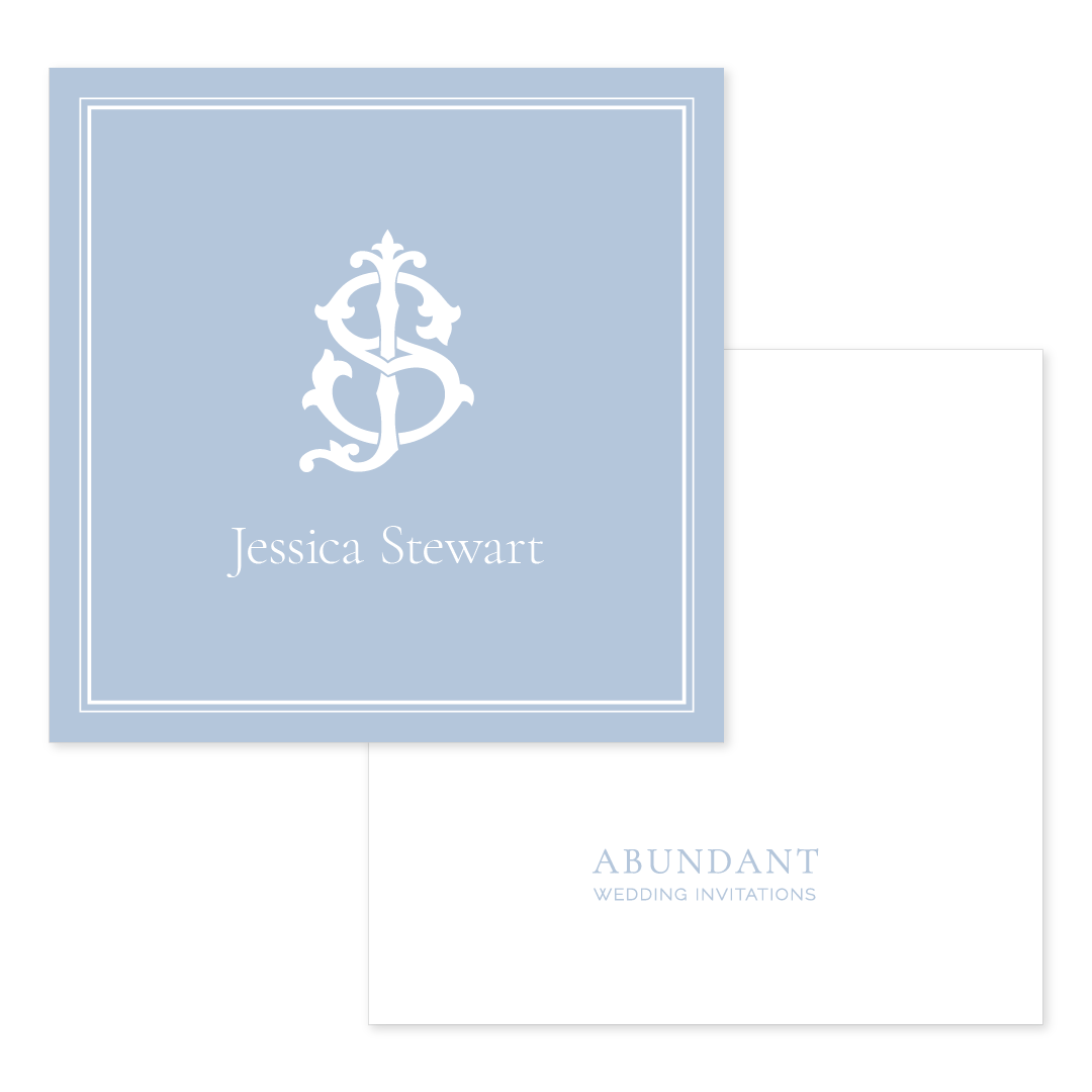 Square calling card in pale blue with an elegant white monogram and name centered, paired with a clean white back displaying subtle branded text.