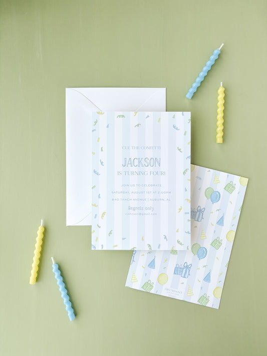 Birthday invitation card with soft blue and green confetti design on a light striped background, accompanied by matching envelope and pastel-colored spiral candles.
