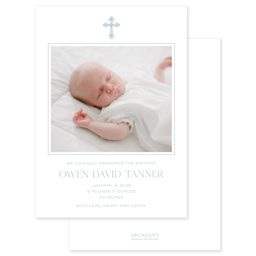 Baby blue birth announcement newborn photo and vintage cross on white paper
