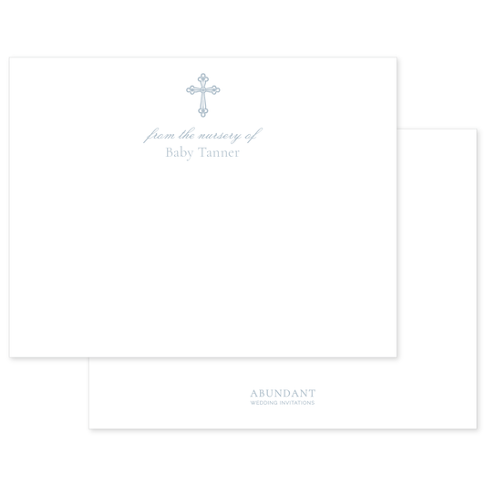 Flat white notecard featuring a delicate blue cross and personalized nursery text with elegant, timeless typography.