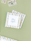 Stack of floral stripe calling cards featuring elegant script and delicate botanical border designs on a soft green background