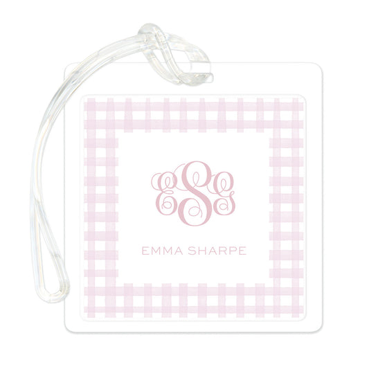 Square bag tag featuring a pink gingham pattern border with elegant monogram initials and a clear strap for attachment.
