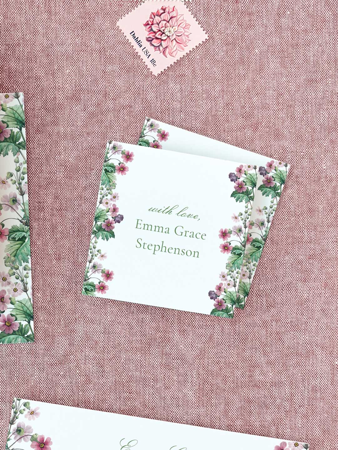 Square calling card with delicate pink floral border and personalized elegant green script on textured background