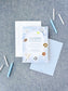 Birthday invitation with sports-themed icons such as tennis, baseball, football, basketball, and soccer on a blue background