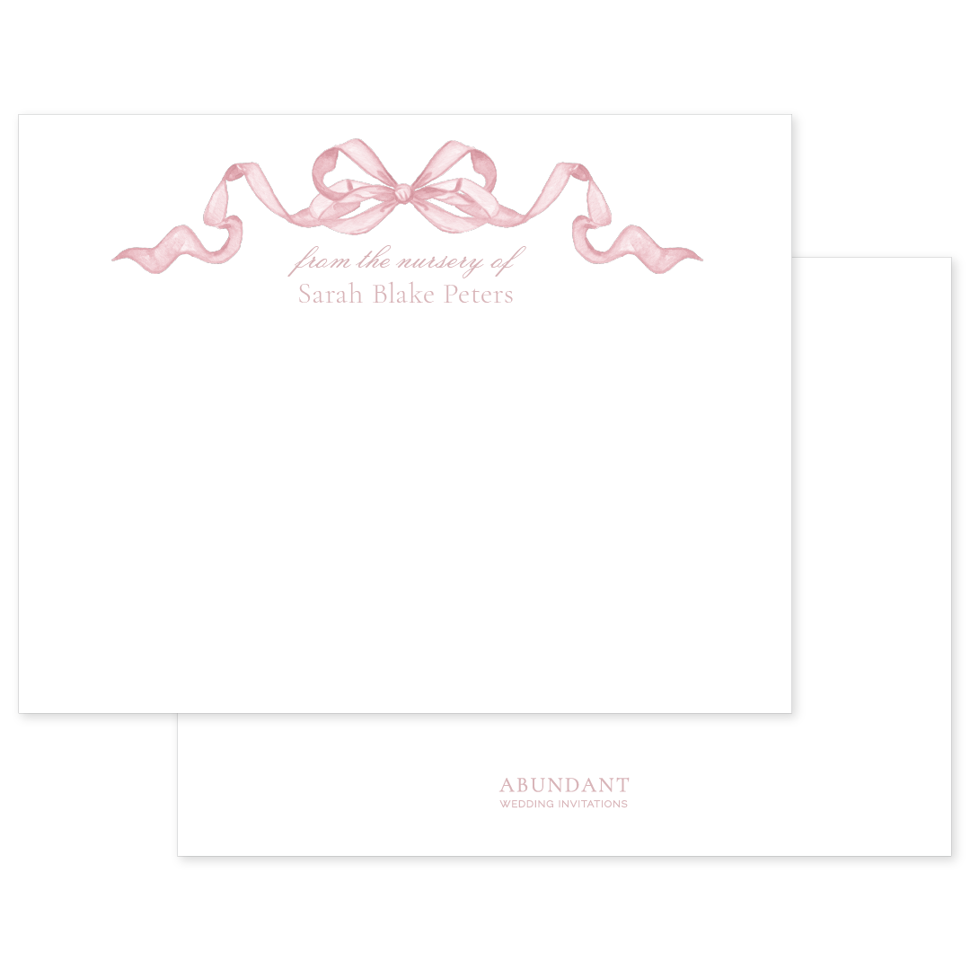 Elegant notecard featuring a soft pink watercolor bow and personalized nursery text in graceful script on white background.